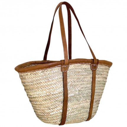 Stylish wicker bag with leather straps, handmade from palm leaves.