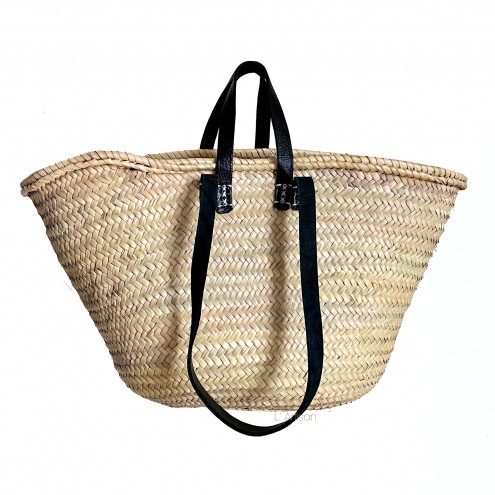 Authentic wicker bag with leather handles, handcrafted from durable palm leaves.