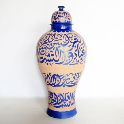 Beautiful Moroccan vase with intricate Arabic calligraphy and blue glaze, perfect for home decor.