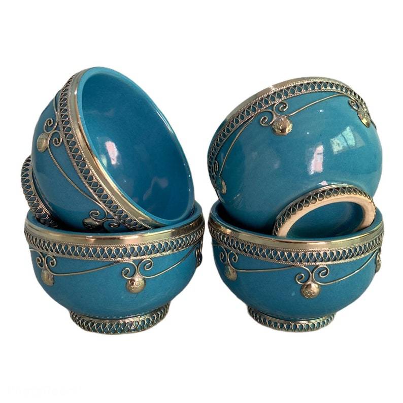 Set of 4 handcrafted petrol blue Moroccan ceramic bowls with intricate designs.