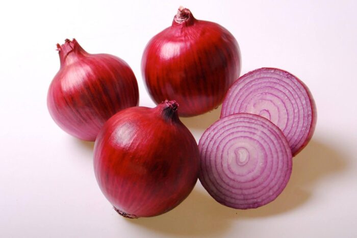 Fresh Moroccan purple onions showcasing their vibrant color and freshness.